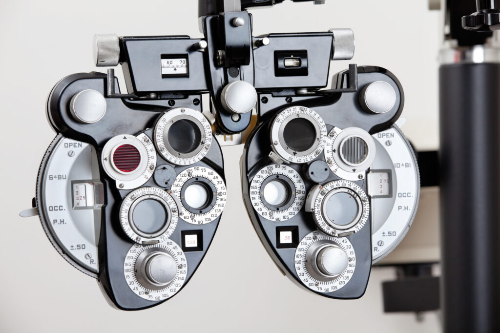 What Are the 3 Types of Eye Doctors? 7 A Phoropter an optical clinical testing machine or equipment pictured over a blank wall