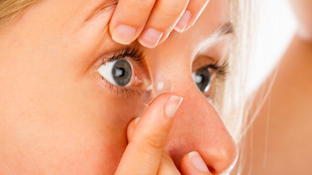 How to Put In and Take Out Contact Lenses 2 Close up shot of a young woman putting on her soft contact lens edited