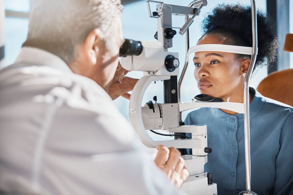 Buying Non-Prescription Colored Contacts Safely 10 eye exam black woman consulting with an eye doctor min