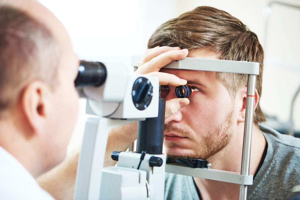 Pigmentary Glaucoma 2 Young Caucasian man undergoing an eye exam